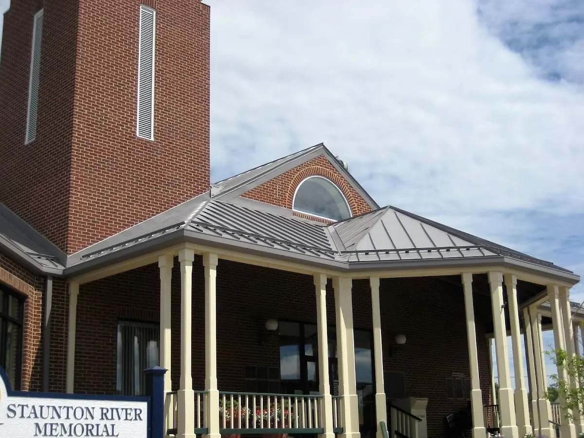 Skilled roofing craftsmen working on a residential roof in Powerville